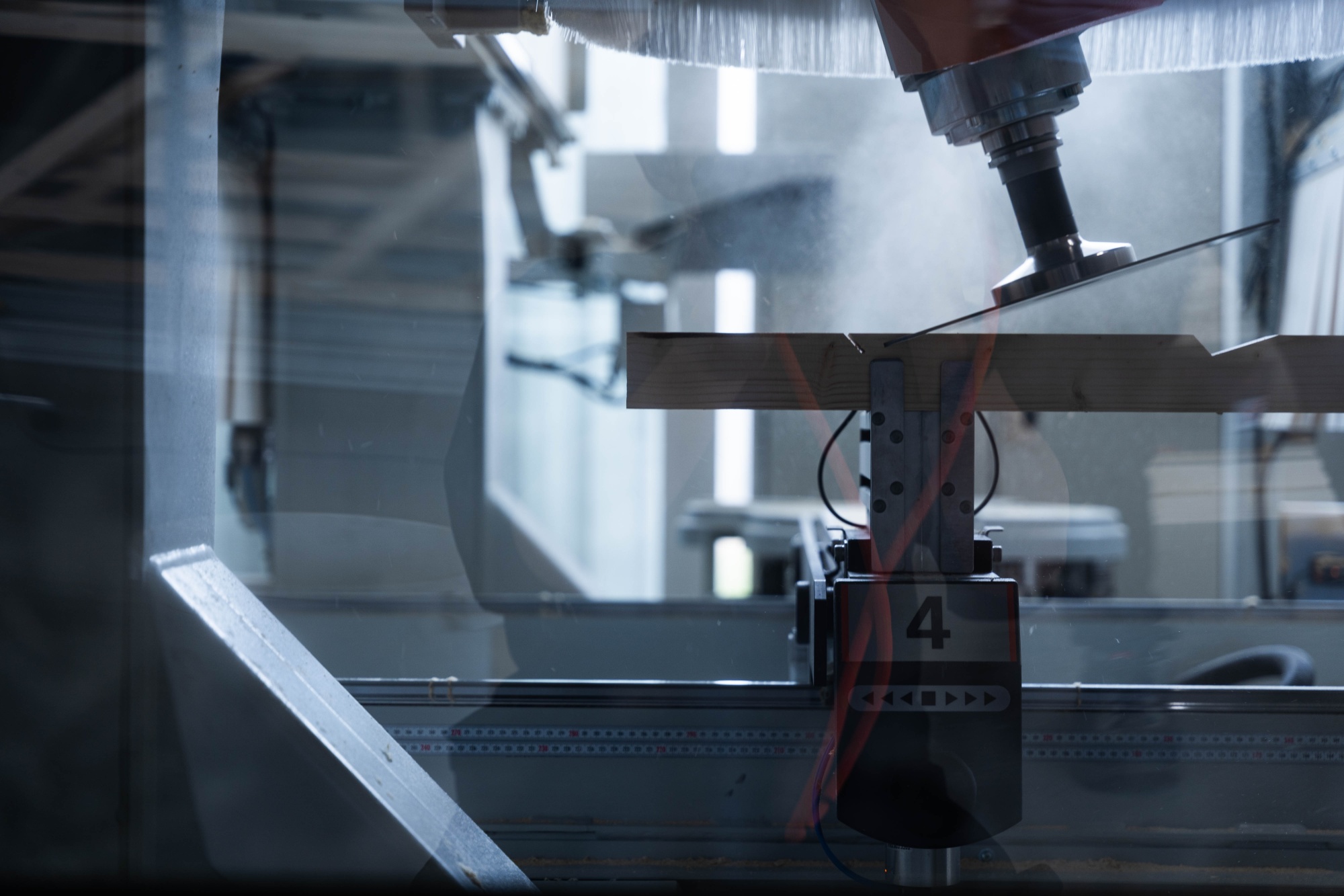 CNC machine cutting a timber beam